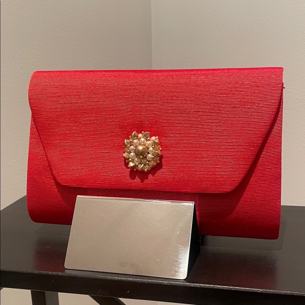 Elegant Red Clutch with Pearl Brooch